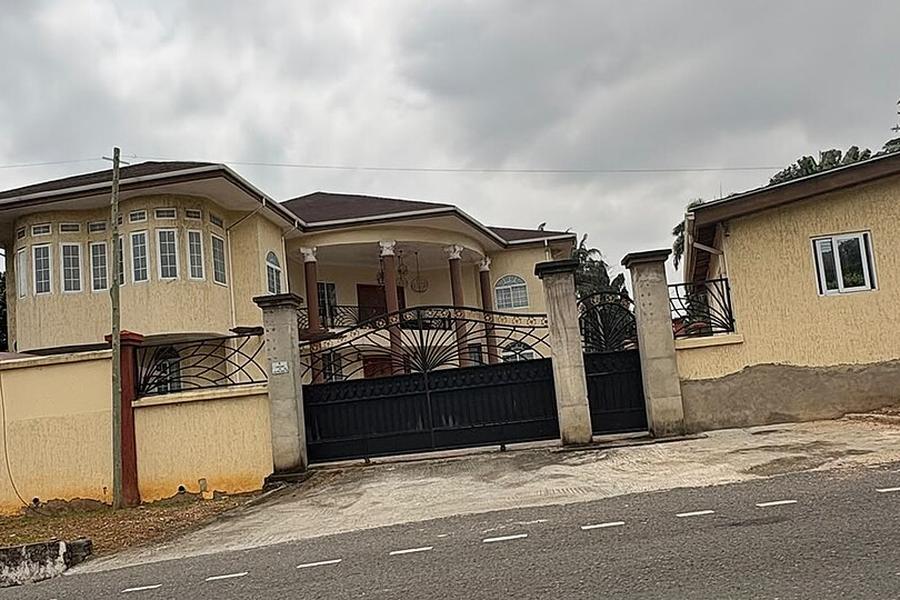 Family houses behind gated walls in Airport Residential, Accra